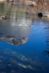 Mountains reflected in a river