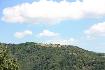 between the green Tuscan hills and the rural villages in the rustic countryside