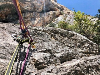 a rope on the rock for climbing