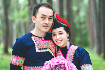 Portrait of Hmong couple with bouquet of flower, Wedding portrait of Hmong couple in the park
