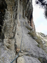 a rope on the rock for climbing