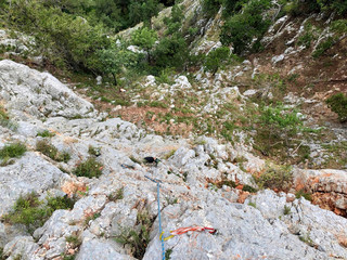 a rope on the rock for climbing