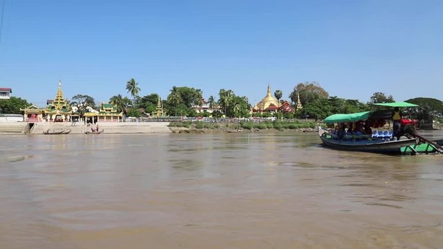 visitors taking boats to island (Ye Le) pagoda on a small island in the river at Kyauktan village, about 15 km South of Thanlyin, Yangon, Burma (Myanmar).
