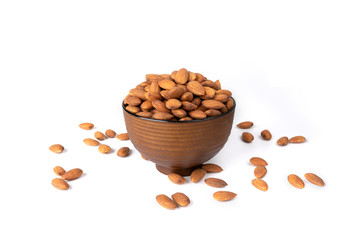 Almonds in wooden bowl isolated on white background
