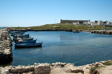 Fototapeta premium Mahdia Tunisia, view across the ancient phoenician fishing port to town and fort