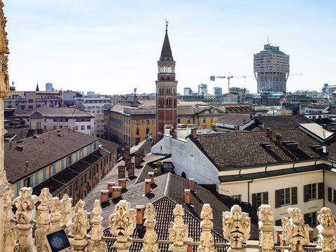 MILAN, ITALY - FEBRUARY 24, 2019: view of bell tower of church San Gottardo a Palazzo over Milan city from roof of Milan Cathedral (Duomo di Milano). This Basilica is the largest church in Italy