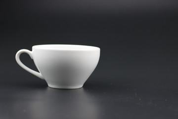 Empty white coffee cup on black color background