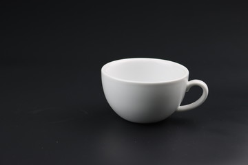 Empty white coffee cup on black color background