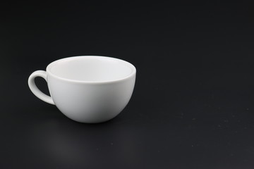 Empty white coffee cup on black color background