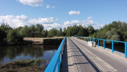 wooden bridge across the river