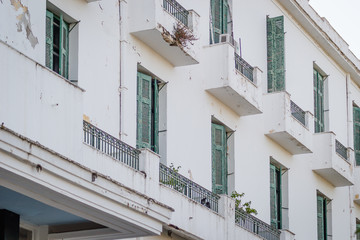Fototapeta na wymiar Blinds on the windows of an abandoned hotel 