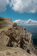 Mountain landscape with blue sky and clouds.
