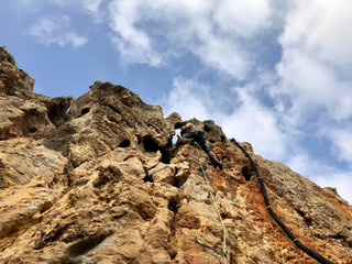 a rope on the rock for climbing