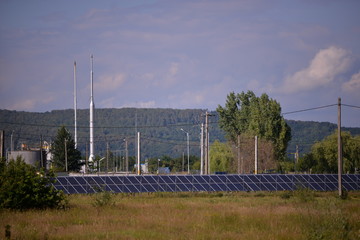 oil park near the solar panel farm. changing the environment in an ecological way 