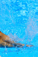Woman legs in the pool