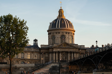 Fototapeta na wymiar French Institute, The Institute of France at sunset, seen from the Pont des Arts. Paris - France, 31. mai 2019.