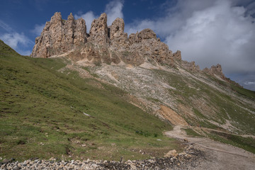 Denti di Terrarossa (Terrarossa Teeth) peaks, part of Sciliar/Schlern mountain chain, seen on the trail from Alpe di Tires refuge down to Alpe di Siuse/Seiser Alm plateau, Dolomites, Italy