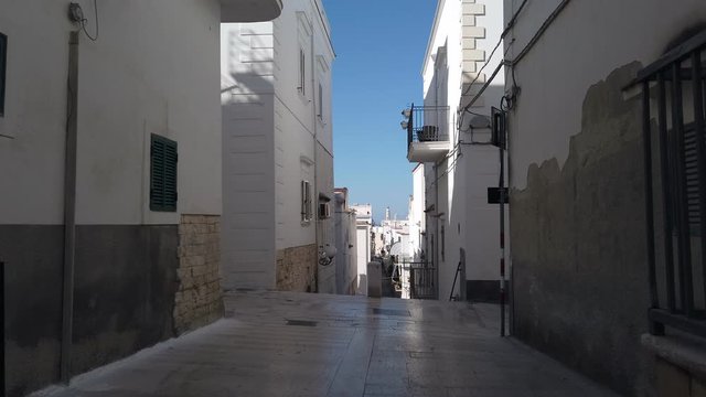 walking through south italy village narrow streets of Vieste in Puglia - Italy 