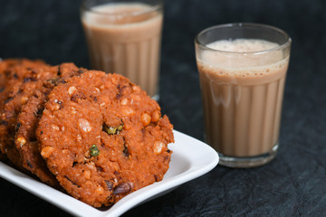 Parippu vada with Indian milk tea or Chai , Kerala Snacks popular deep fried hot and spicy tea time food. Traditional food for Ramadan, Eid, Iftar pary, Onam, Vishu. Local street food of India.