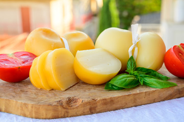 Cheese collection, Italian cheese scamorza made from cow milk in South Italy, white and yellow smoked.