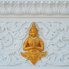 traditional Asian ornament on stone wall. decoration Elements of buddhist temple. 