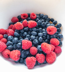Colorful, juicy background of blackberries and raspberries. Healthy food concept.