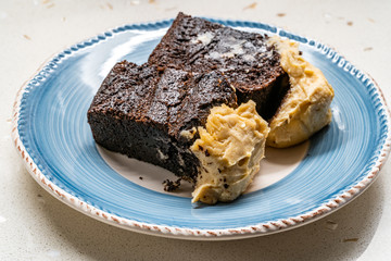 Belgium Chocolate Cake with Peanut Butter Cream served with Plate.