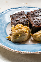 Belgium Chocolate Cake with Peanut Butter Cream served with Plate.
