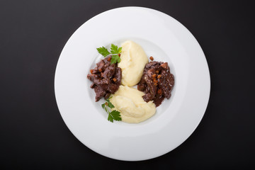 Beef stroganoff served with mashed potatoes