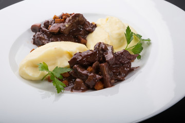 Beef stroganoff served with mashed potatoes
