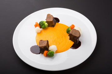 Meat beef medalions served with sauce