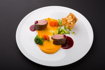 Meat beef medalions served with sauce