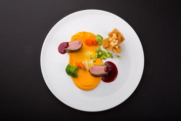 Meat beef medalions served with sauce