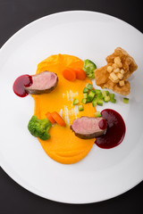 Meat beef medalions served with sauce