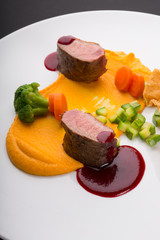 Meat beef medalions served with sauce