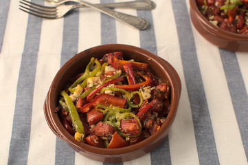 Clay pot with traditional Greek food