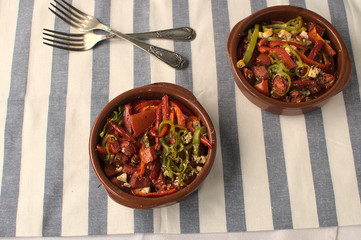 Clay pot with traditional Greek food