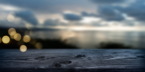 Picturesque nature scene in autumn by the sea
Old wooden table by the sea on an autumn evening. Moody background with short depth of field and golden bokeh. Space for design and text. - obrazy, fototapety, plakaty