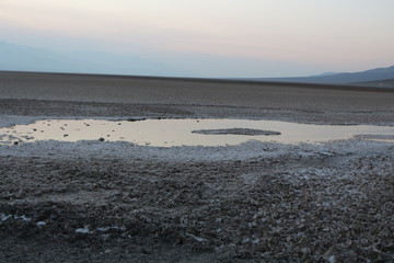 Badwater basin salt flats Death Valley at sunset in summer