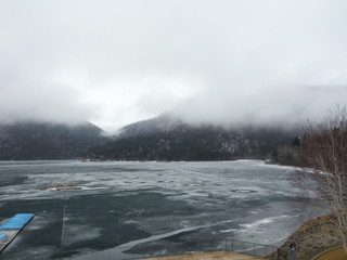 fog in the mountains and a lake