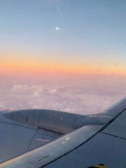 Fototapeta na wymiar airplane in the sky at sunrise