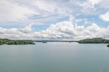 panama canal lakes section under cumulous clouds