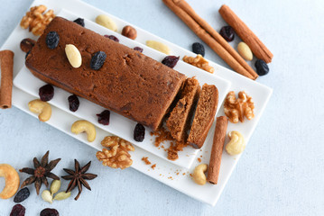 Christmas plum cake in Kerala, Indian Christmas  celebration, Homemade cake pieces. Fruitcake made with dried fruit, nuts, spices and rum for  New Year party, Easter etc.