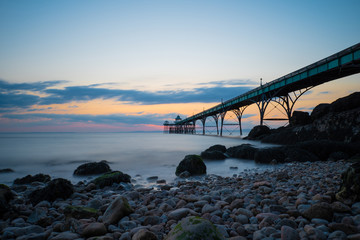 Pier over ocean at sunset in Clevedon, Somerset, England