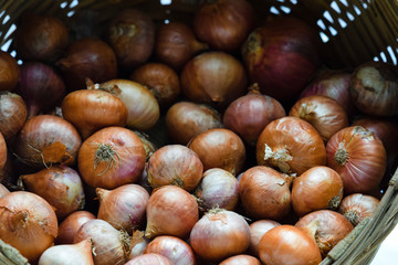 Close up view of small Onions. Indian vegetables heap small shallot onions from market
