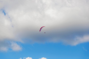 Paragliding in the sky on a sunny day.