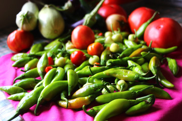 close-up composition of tomato, pepper, zucchini, and eggplant