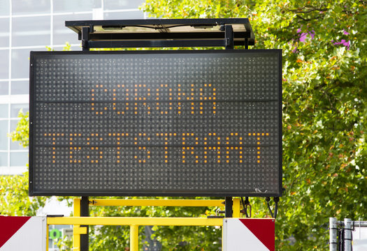 Dutch corona test street information sign ito indicate a test center n Arnhem, Netherlands. Translation: teststraat means test street
