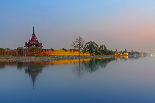 Mandalay Palace at the twilight, with its reflection in the water, Mandalay, Myanmar