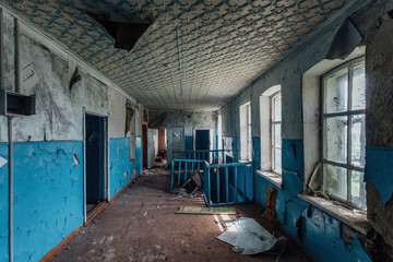 Abandoned school interior, dirty room, rotten peeled walls